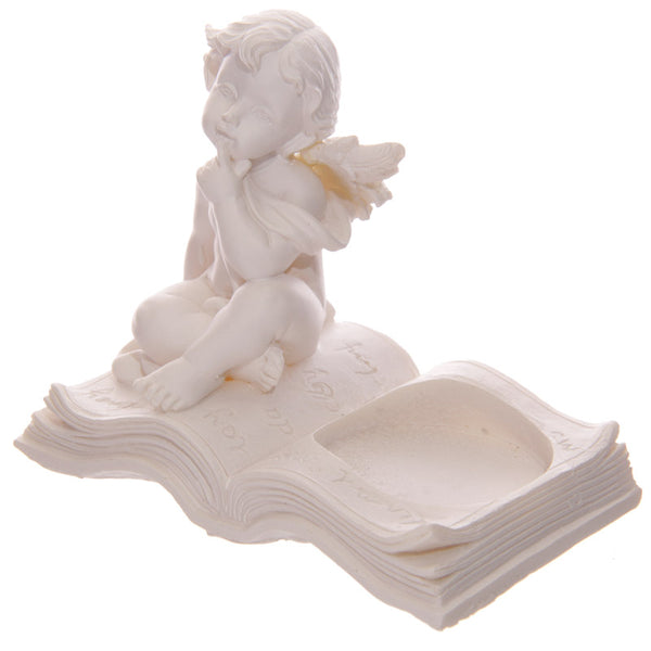 Cherub Tea Light Holder Sitting on Book