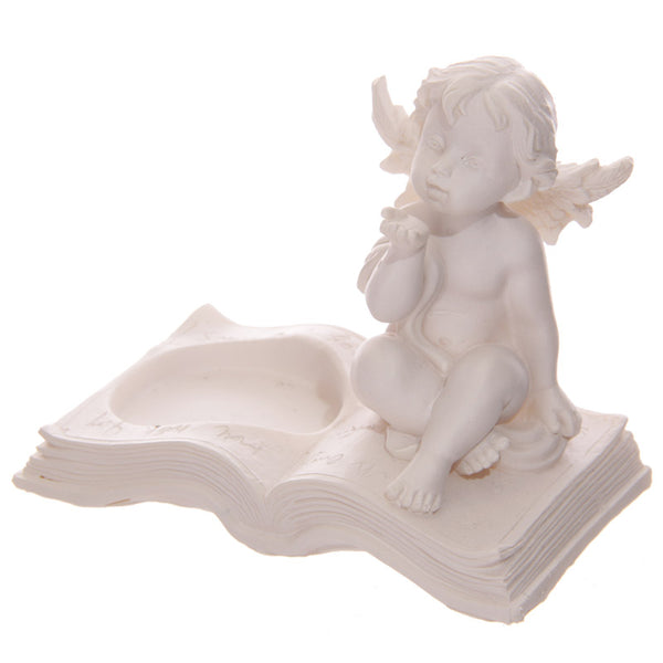 Cherub Tea Light Holder Sitting on Book