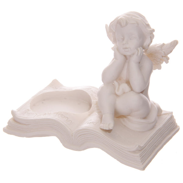 Cherub Tea Light Holder Sitting on Book