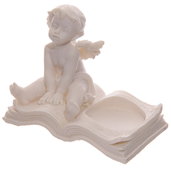 Cherub Tea Light Holder Sitting on Book